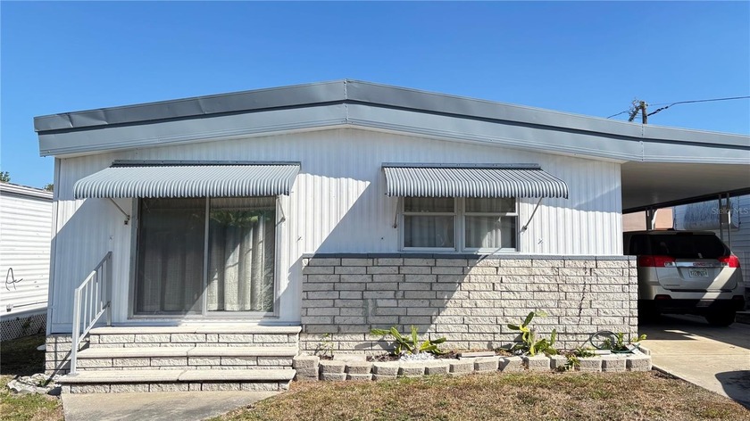 Discover the potential in this partially furnished double-wide - Beach Home for sale in St. Petersburg, Florida on Beachhouse.com