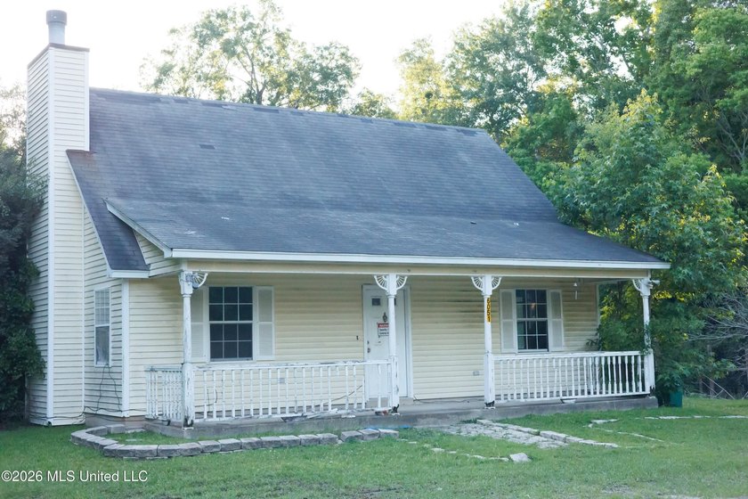 Situated on approximately 2 beautiful acres in the heart of Old - Beach Home for sale in Long Beach, Mississippi on Beachhouse.com