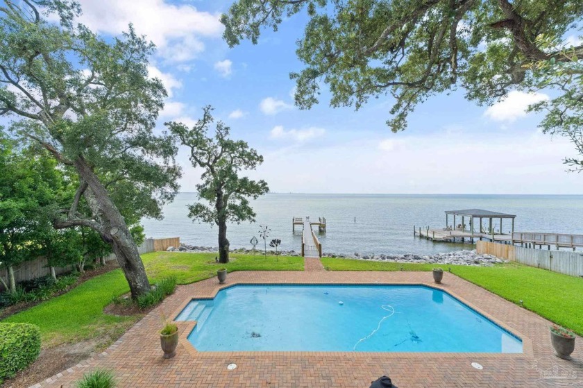 Nestled directly on Pensacola Bay, this exquisite home offers - Beach Home for sale in Pensacola, Florida on Beachhouse.com