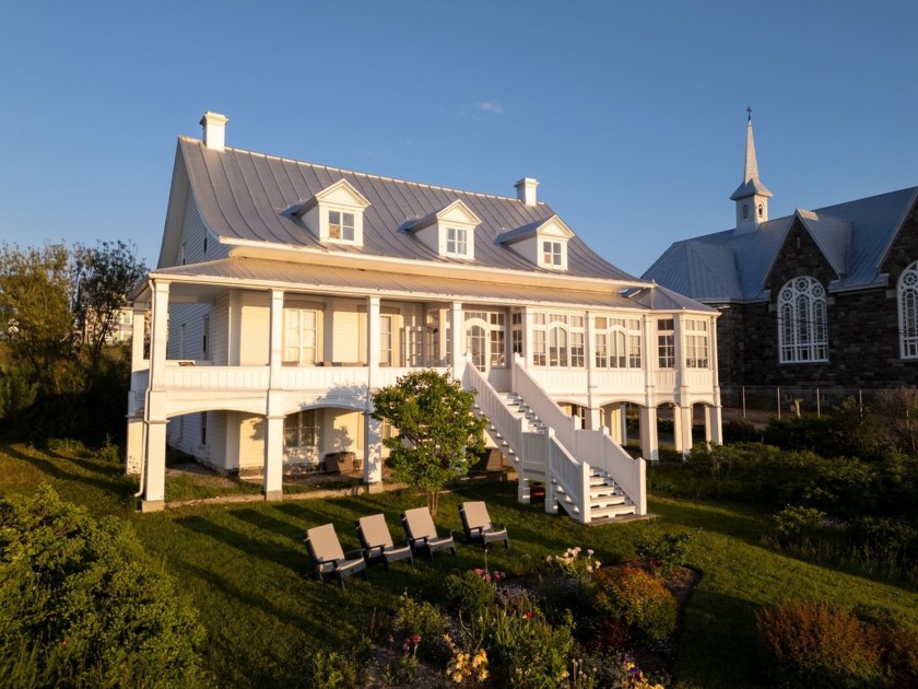 Majestueusement dresse au bord du fleuve depuis 1864, cet ancien - Beach Home for sale in Baie-Des-Sables,  on Beachhouse.com