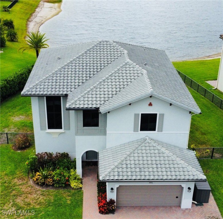 Enjoy stunning lake views and golden sunsets from this spacious - Beach Home for sale in Ave Maria, Florida on Beachhouse.com