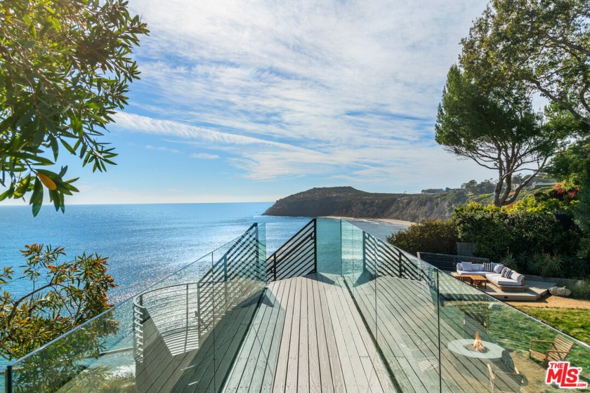 Commanding an unobstructed panorama of sky and sea, this gated - Beach Home for sale in Malibu, California on Beachhouse.com