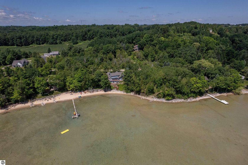 An exceptional opportunity to own a rare double lot on coveted - Beach Home for sale in Traverse City, Michigan on Beachhouse.com