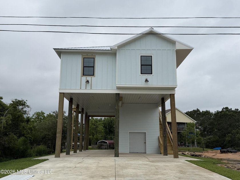 Welcome to this stunning new construction waterfront home! This - Beach Home for sale in Bay Saint Louis, Mississippi on Beachhouse.com