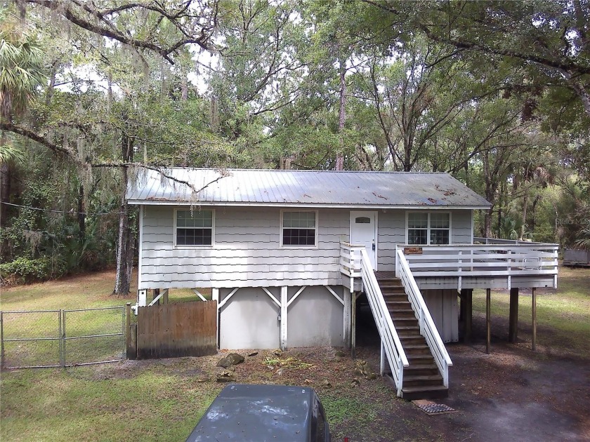 Welcome to charming small-town living. This inviting rustic home - Beach Home for sale in Inglis, Florida on Beachhouse.com