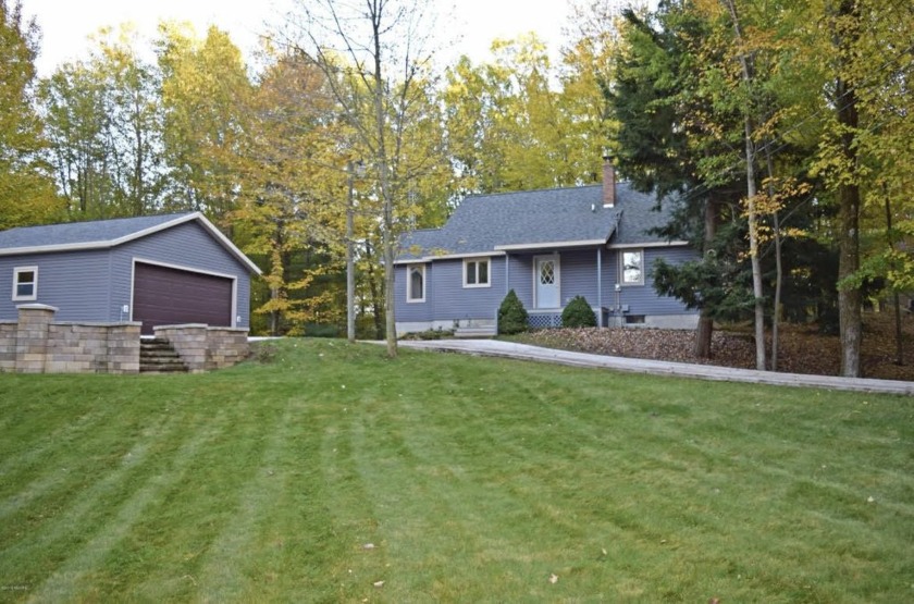 Offering immediate access to 135-acre private woodlands with - Beach Home for sale in Manistee, Michigan on Beachhouse.com