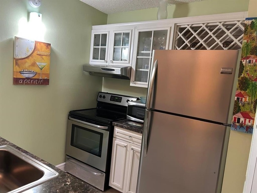 Situated on the second floor, this inviting unit features a - Beach Condo for sale in Coral Springs, Florida on Beachhouse.com