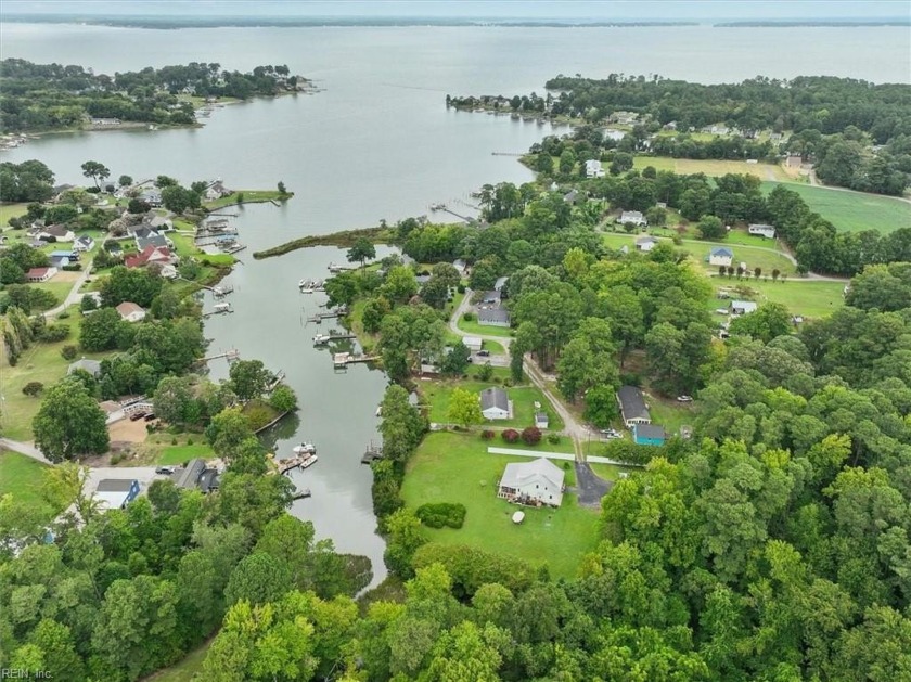 Situated on 2.2 acres at the end of Sturgeon Creek, this cottage - Beach Home for sale in Deltaville, Virginia on Beachhouse.com