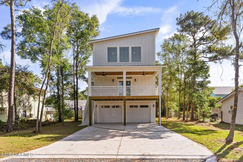 Discover coastal living at its finest at 126 S Middleton Ave - Beach Home for sale in Oak Island, North Carolina on Beachhouse.com