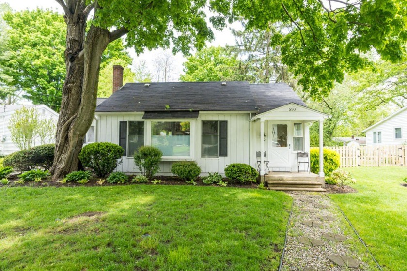 Welcome Home to this charming, immaculately maintained house on - Beach Home for sale in Saugatuck, Michigan on Beachhouse.com