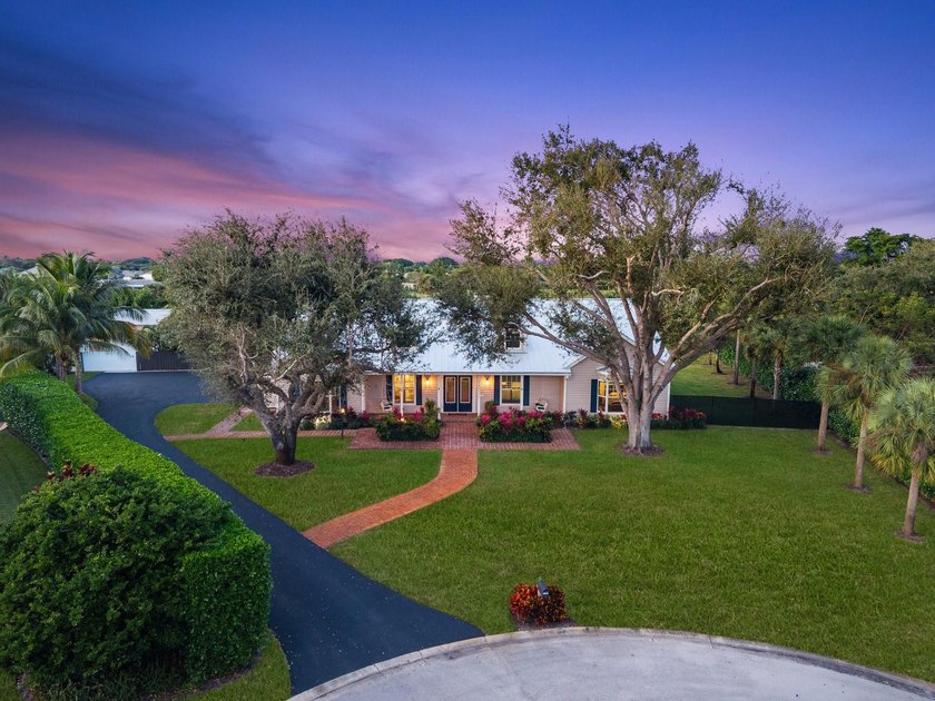 Tucked within coveted Prestwick Estates, this beautiful & - Beach Home for sale in Boynton Beach, Florida on Beachhouse.com
