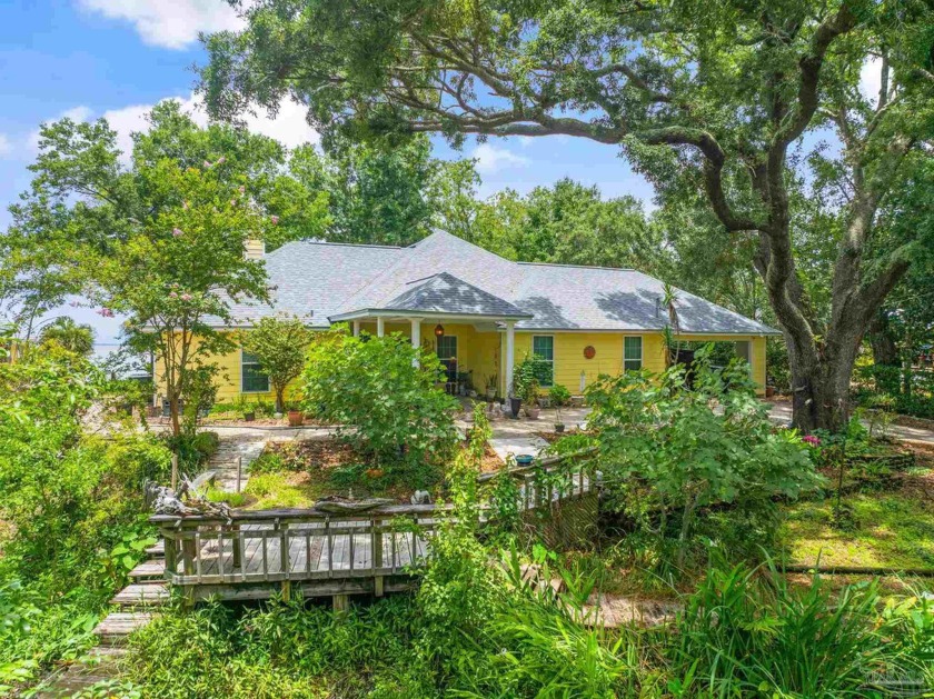 Welcome to your 1.58 ACRE dream retreat with 150 +/- FEET of - Beach Home for sale in Gulf Breeze, Florida on Beachhouse.com