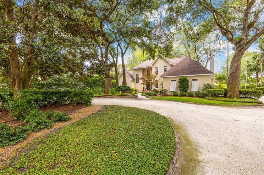 Immaculately maintained showcase home with a pool, located on - Beach Home for sale in Saint Simons, Georgia on Beachhouse.com