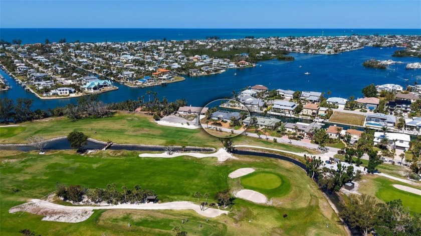 Nestled in the prestigious waterfront community of Key Royale on - Beach Home for sale in Holmes Beach, Florida on Beachhouse.com