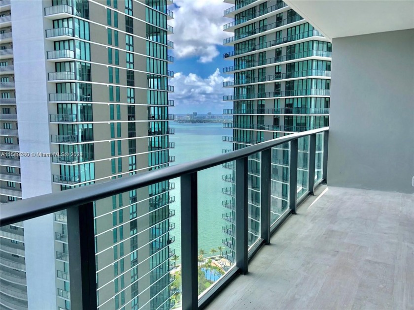 Enjoy exquisite views from your balcony at the 30th floor. Unit - Beach Condo for sale in Miami, Florida on Beachhouse.com