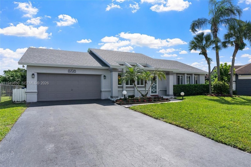 Enjoy peace of mind from day one with a brand-new roof and - Beach Home for sale in Cooper City, Florida on Beachhouse.com