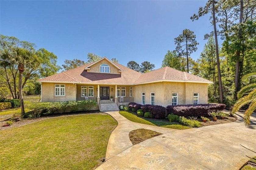 Welcome Home to this stunning 5-bedroom, 5-bathroom sanctuary - Beach Home for sale in Brunswick, Georgia on Beachhouse.com