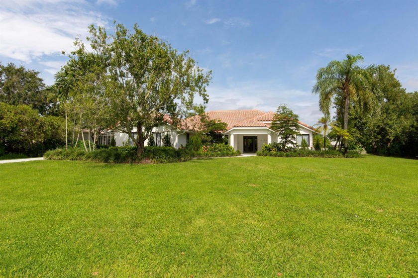 This gorgeous pool home is situated on a larger, 1.13-acre - Beach Home for sale in Wellington, Florida on Beachhouse.com