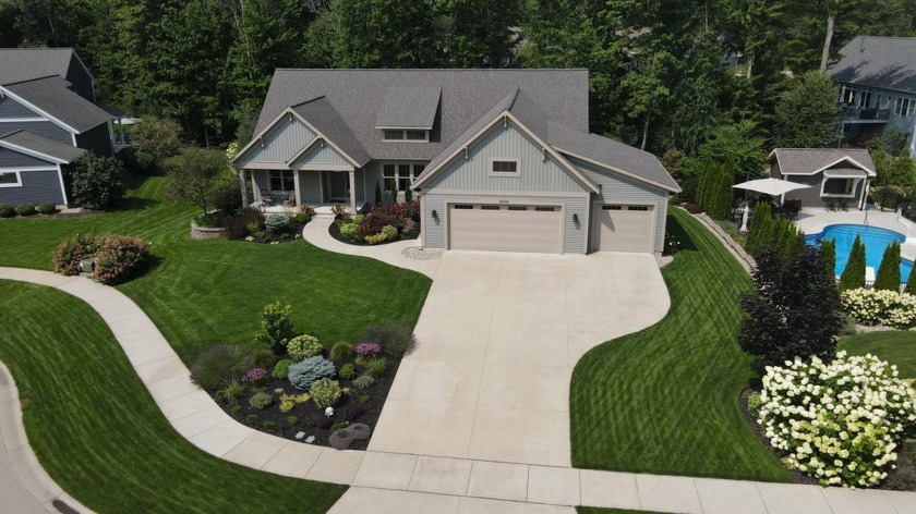 Experience the epitome of luxury living in the exclusive - Beach Home for sale in Spring Lake, Michigan on Beachhouse.com