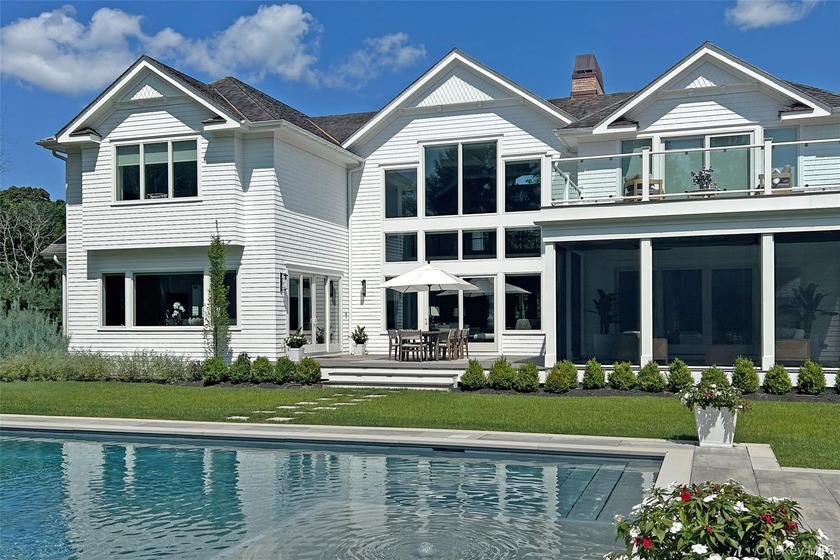 Behind a gated entry on 2 manicured acres, this exceptional - Beach Home for sale in Quogue, New York on Beachhouse.com