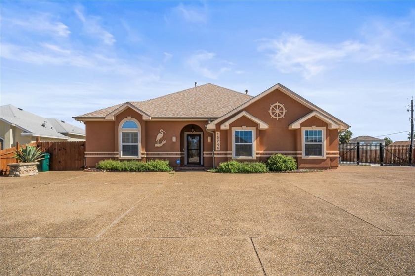 This beautifully maintained home sits on a large canal-front - Beach Home for sale in Corpus Christi, Texas on Beachhouse.com