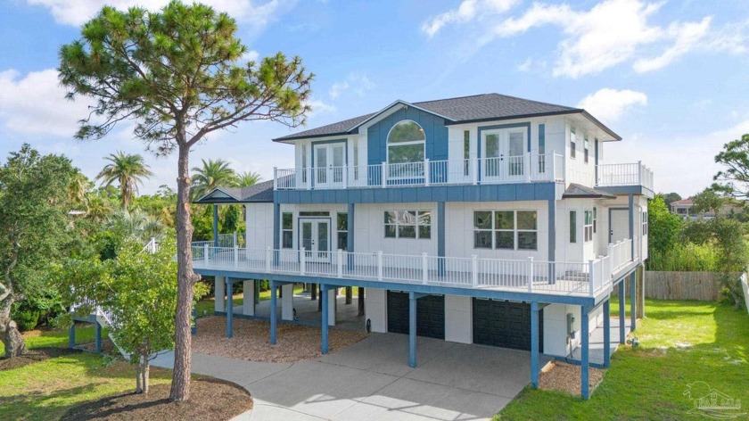 Nestled in a prestigious neighborhood, this water view home - Beach Home for sale in Gulf Breeze, Florida on Beachhouse.com