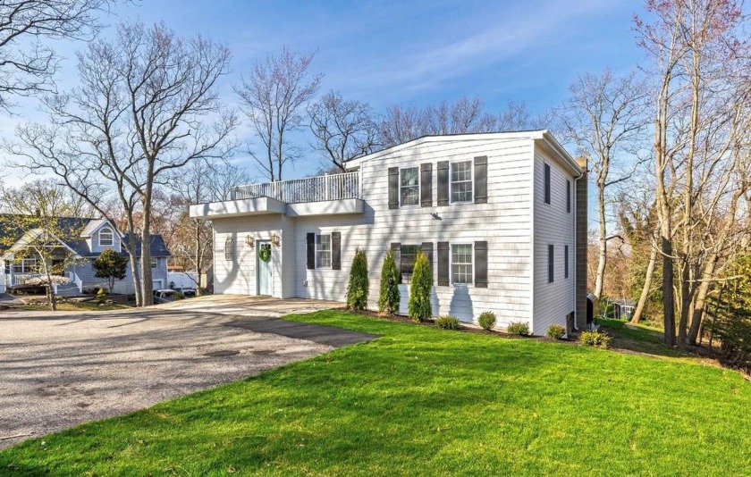 Stunning completely updated Post Modern Colonial set atop the - Beach Home for sale in Rocky Point, New York on Beachhouse.com