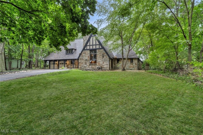 Perched above the Chagrin River, this French Tudor estate is - Beach Home for sale in Willoughby, Ohio on Beachhouse.com