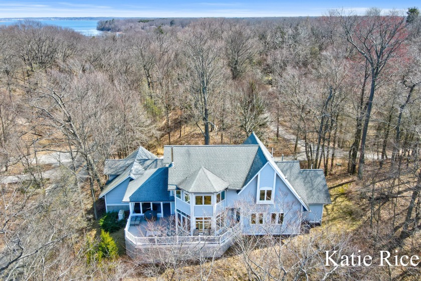 Perched on a hill overlooking the beauty of Lake Michigan, this - Beach Home for sale in Whitehall, Michigan on Beachhouse.com