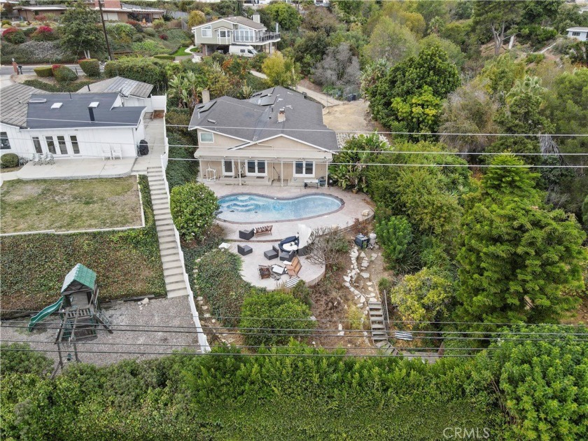 Set on over an acre of hillside with views of the ocean and - Beach Home for sale in Rancho Palos Verdes, California on Beachhouse.com