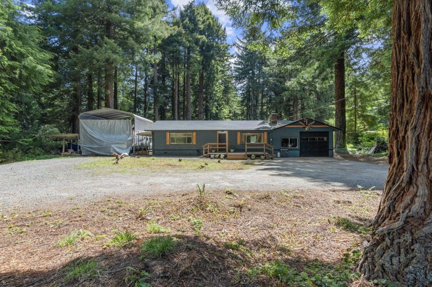 Tucked beneath towering redwoods on a full acre, this 2-bedroom - Beach Home for sale in Crescent City, California on Beachhouse.com