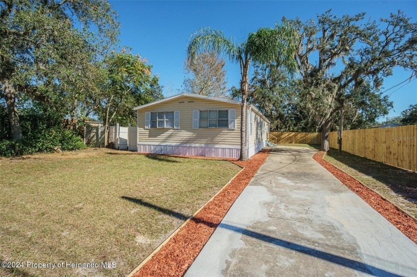 Welcome to this 3/2 completely restored home in the Moon Lake - Beach Home for sale in New Port Richey, Florida on Beachhouse.com