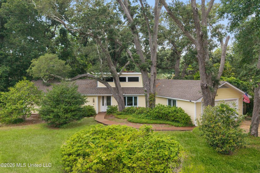 Nestled beneath a canopy of majestic live oaks on a large - Beach Home for sale in Pass Christian, Mississippi on Beachhouse.com