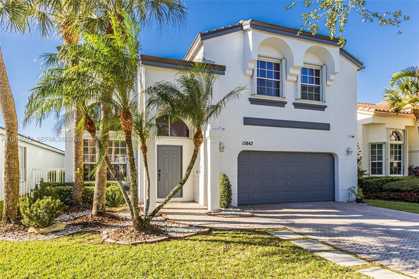 Stunning lakefront single-family home in a secure gated - Beach Home for sale in Pembroke Pines, Florida on Beachhouse.com