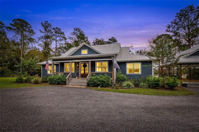 Southern Charm Meets Lakeside Living. Nestled on 3.38 acres of - Beach Home for sale in Brunswick, Georgia on Beachhouse.com