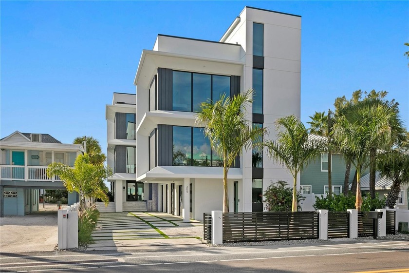 Modern sophistication meets exceptional beachfront living in - Beach Home for sale in Indian Rocks Beach, Florida on Beachhouse.com