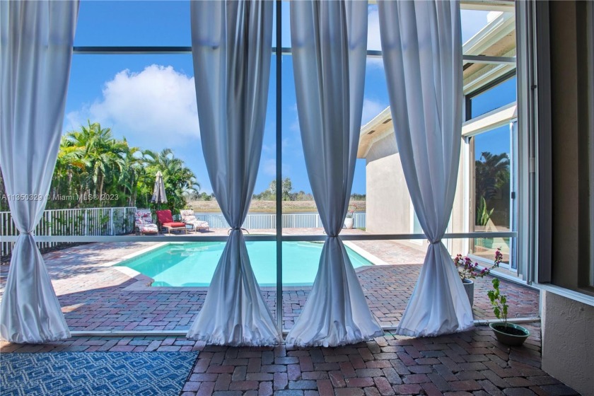 Experience luxurious waterfront living in this stunning 5/3 pool - Beach Home for sale in Miramar, Florida on Beachhouse.com