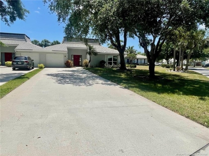 This 2/2 plus den with a 1 car garage is set on a peaceful lake - Beach Home for sale in Palm City, Florida on Beachhouse.com