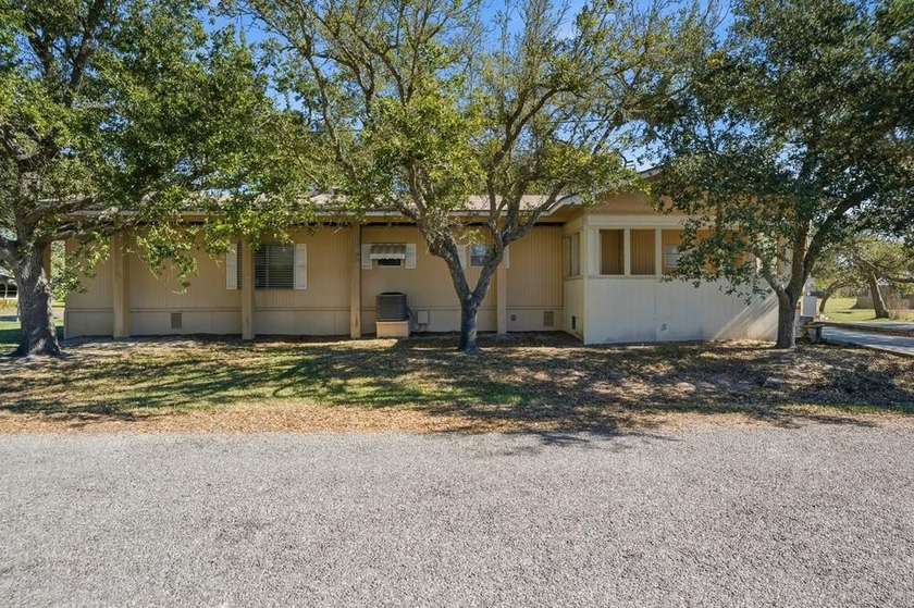 Cute mobile home with a new engineered roof placed over home - Beach Home for sale in Rockport, Texas on Beachhouse.com