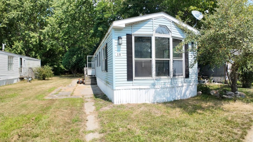 Welcome to this 2-bedroom, 1-bath 1988 Schult mobile home in the - Beach Home for sale in Norton Shores, Michigan on Beachhouse.com