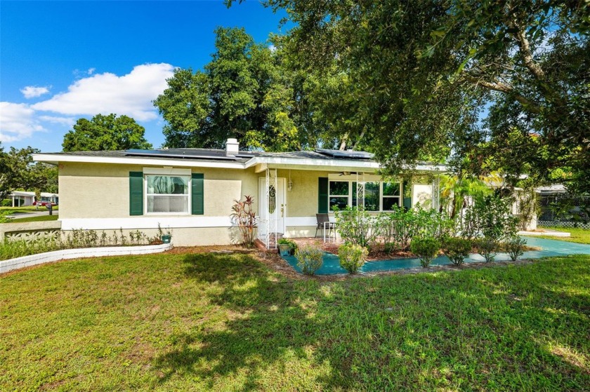 This charming 2-bedroom, 1-bathroom house offers a perfect blend - Beach Home for sale in Kenneth City, Florida on Beachhouse.com