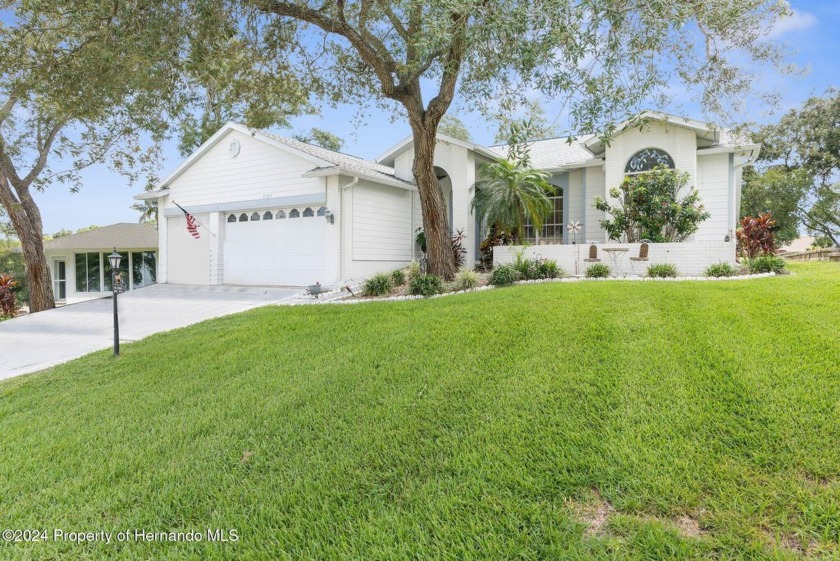 Welcome to this 3 Bedroom, 2 Bathroom, 3 Car Garage Nestled on - Beach Home for sale in Spring Hill, Florida on Beachhouse.com