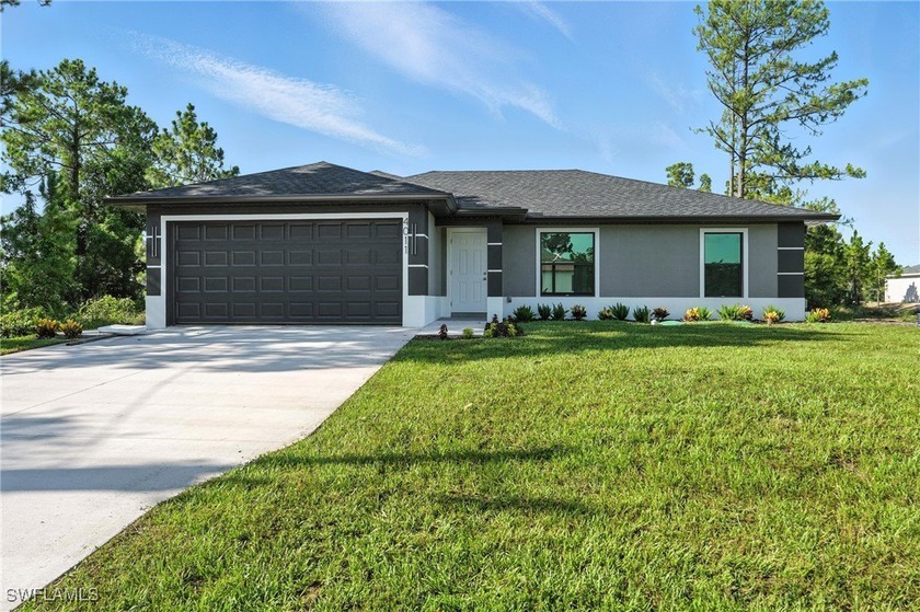 Tucked away in a private cul-de-sac, this brand-new home blends - Beach Home for sale in Lehigh Acres, Florida on Beachhouse.com