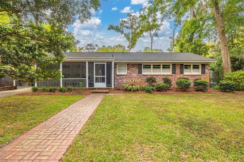 Welcome to this charming brick ranch, all on one level, nestled - Beach Home for sale in Saint Simons, Georgia on Beachhouse.com