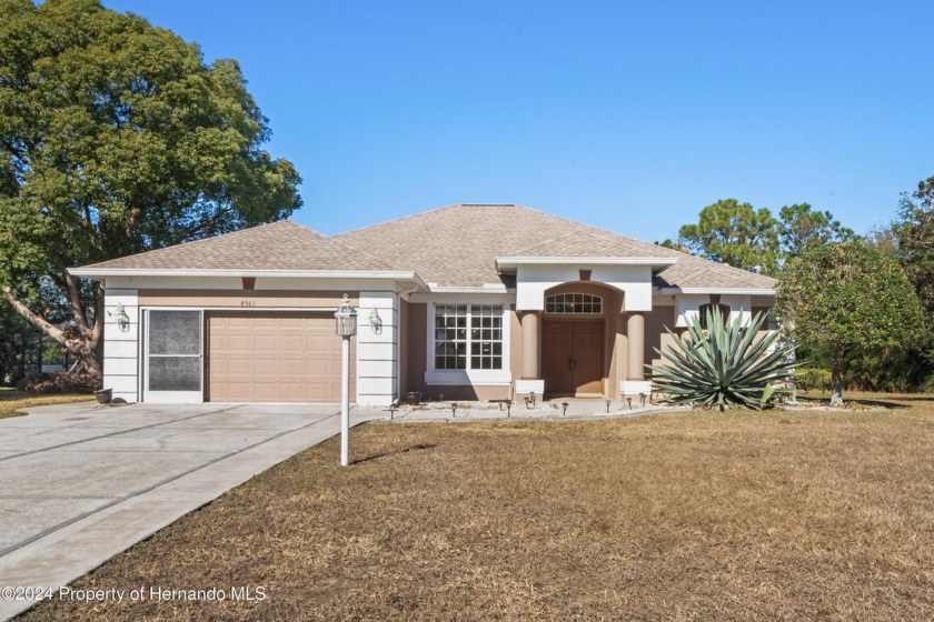 Welcome to your dream lakefront retreat on the serene shores of - Beach Home for sale in Spring Hill, Florida on Beachhouse.com