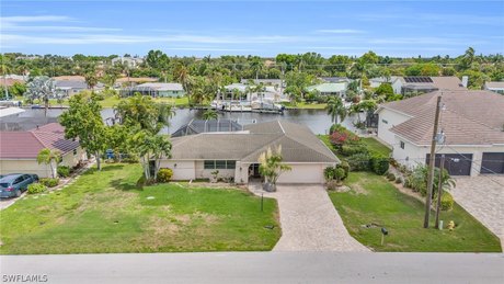 Discover waterfront living at its finest at 1041 N Waterway Dr - Beach Home for sale in Fort Myers, Florida on Beachhouse.com