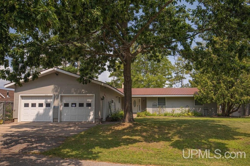 Enjoy one-level lake living on the picturesque east side of - Beach Home for sale in Manistique, Michigan on Beachhouse.com