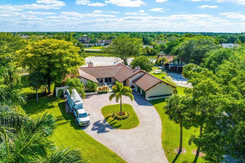 Welcome to this exquisite property that seamlessly combines - Beach Home for sale in Wellington, Florida on Beachhouse.com