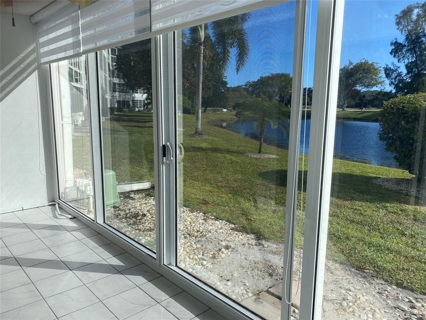 FIRST FLOOR UNIT, WATER VIEW, IMPACT PATIO ENCLOSURE, MOVE IN - Beach Condo for sale in Deerfield Beach, Florida on Beachhouse.com