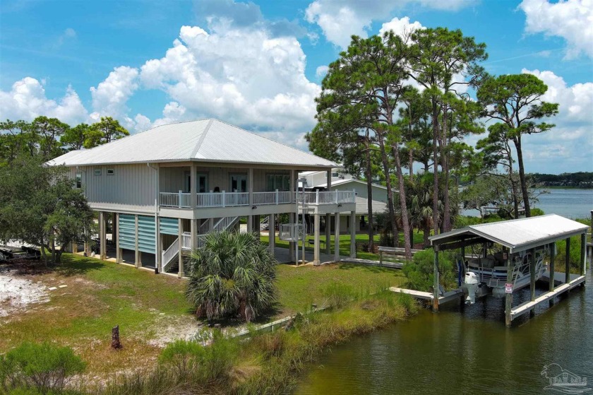 Stunning waterfront home on Ono Island situated at the end of a - Beach Home for sale in Orange Beach, Alabama on Beachhouse.com